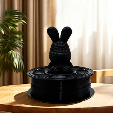 Black PETG filament with printed rabbit model