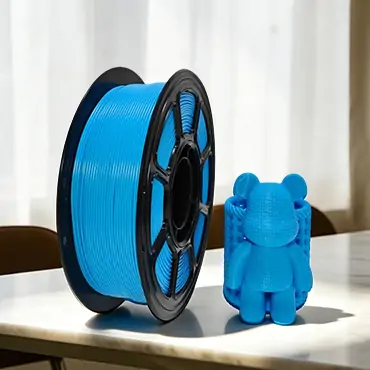 Blue PETG filament with printed bear model
