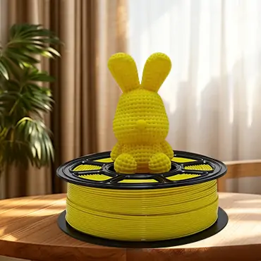 Yellow PETG filament with printed rabbit model